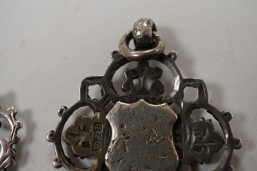 Five assorted early 20th century silver medals, including enamelled 'Luton District Football League, 1910/11', diameter 28mm.